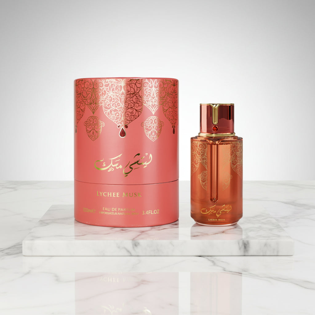 Perfume bottle and packaging with intricate designs on a white background