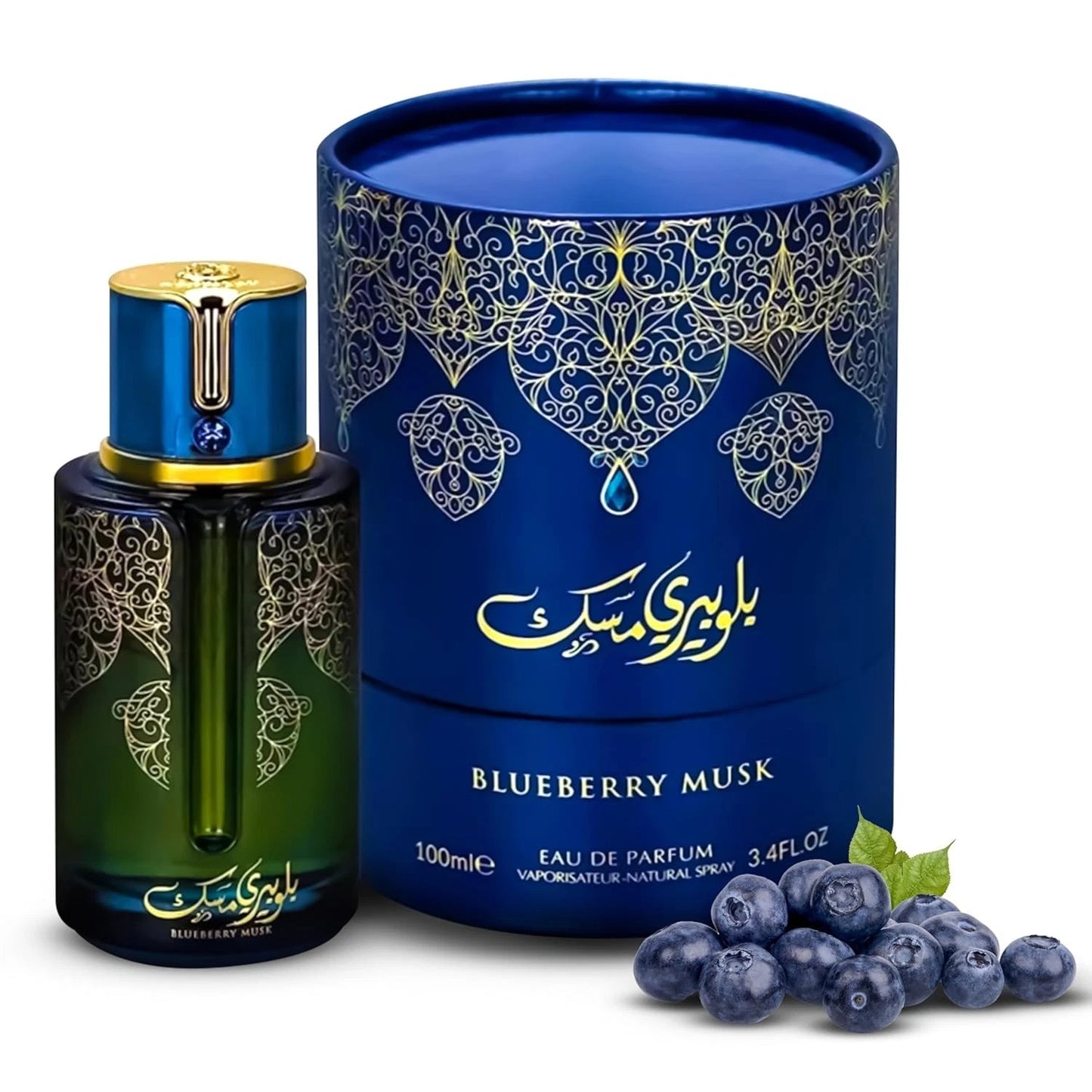 An ARABIYAT PRESTIGE - BLUEBERRY MUSK 3.4FL.OZ EDP SPRAY bottle for women and men stands beside its blue box with gold designs and Persian script, with fresh blueberries arranged in front of the set.