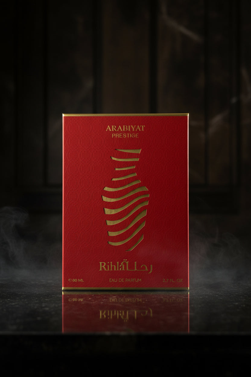 Red and gold Arabiyat Prestige Rihlah perfume box on a white background