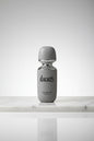 Perfume bottle with 'RAMAD' branding on a white background