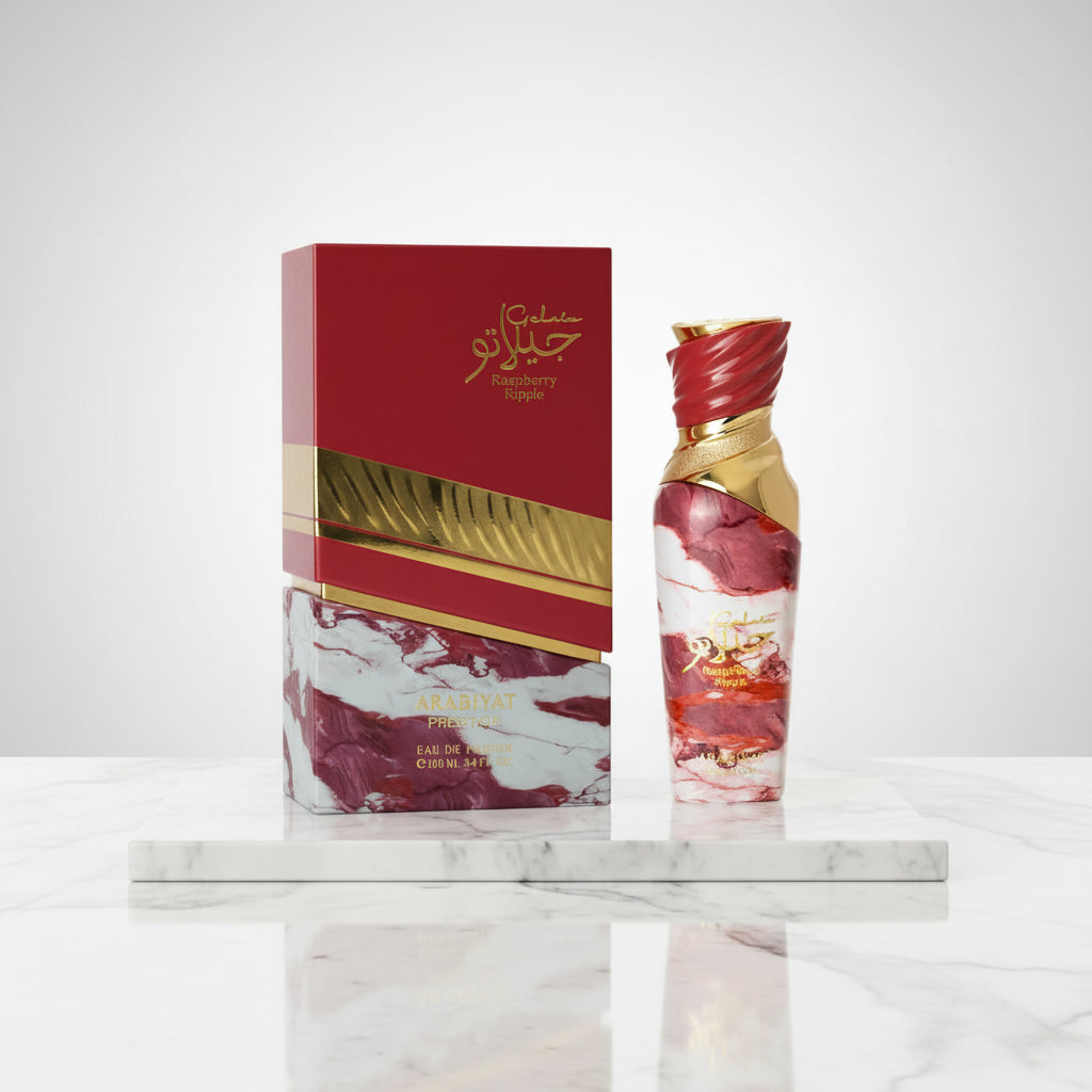 Perfume bottle and packaging with marbled design and gold accents on a white background